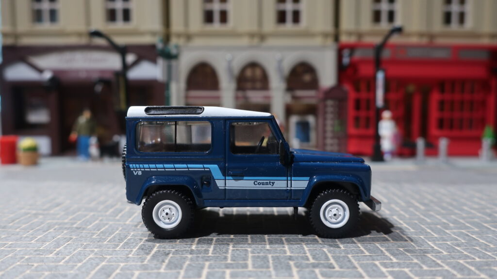 MINI GT Land Rover Defender 90 County Wagon Stratos Blue