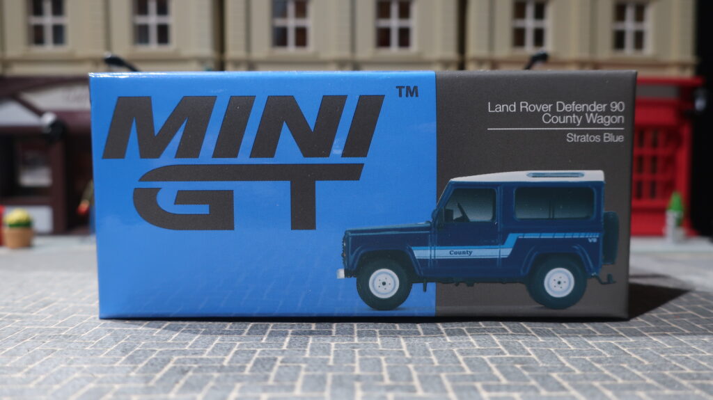 MINI GT Land Rover Defender 90 County Wagon Stratos Blue